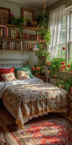 a bed sitting in a bedroom next to a window filled with plants and books on shelves