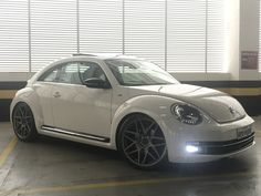 a white car parked in a parking garage