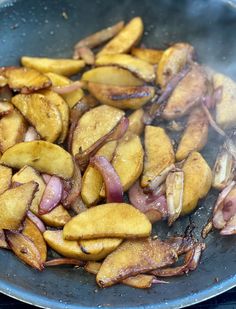 some food is cooking in a pan on the stove