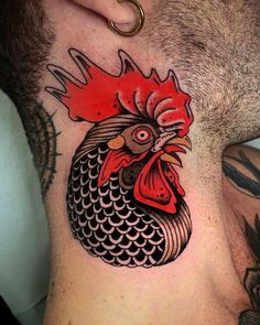 a man's neck with a rooster tattoo on the top of his neck and bottom part