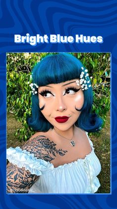 a woman with blue hair and piercings on her face, wearing a white dress