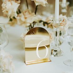 the table is set with flowers and candles