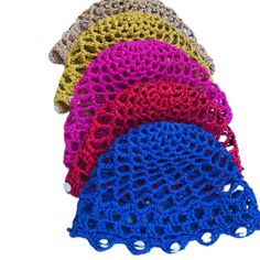 four crocheted doilys are shown in different colors and sizes on a white background