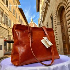 This bag has been made of the best genuine leather by local master crafters of Florence in Italy, designed for women who only accept premium Italian quality and luxury leather bags and modern Italian fashion. . Sizes: Width: 30 cm / 11.8 inches Height: 23 cm / 9.1 inches Depth: 11 cm / 4.4 inches The story of this bag: Once upon a time, in the picturesque city of Florence, Italy, a group of skilled artisans embarked on a journey to create a remarkable handmade leather bag that would epitomize the essence of Italian craftsmanship. Their dedication and expertise gave birth to a brown bag that exuded timeless elegance and unmatched quality. Handcrafted with meticulous attention to detail, this Italian leather bag was a testament to the artisans' unwavering commitment to their craft. The soft, Elegant Vegetable Tanned Leather Travel Bag, Luxury Vegetable Tanned Leather Shoulder Bag With Double Handle, Luxury Vegetable Tanned Leather Shoulder Bag For Daily Use, Elegant Vegetable Tanned Leather Shoulder Bag For Everyday Use, Elegant Satchel In Soft Vegetable Tanned Leather, Elegant Everyday Shoulder Bag In Vegetable Tanned Leather, Elegant Vegetable Tanned Leather Satchel, Elegant Vegetable Tanned Leather Shoulder Bag With Double Handle, Modern Shoulder Bag In Vegetable Tanned Leather