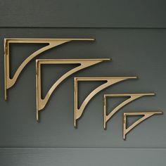 Want to add a touch of timeless elegance to your walls? Our classic ironbridge bracket is not just heavy-duty, it is stylish too. These are solid cast brushed satin brass shelf brackets which are high quality just like they were made in the good old days. Cast by hand using time-honoured techniques. The bracket is brushed by hand and finally lacquered to protect the finish.  Please note, light patination marks might show on this product due to the process used.   * A Classic Design  * High-Quali Brass Shelf Brackets, Brass Shelf, Brass Shelves, Shelving Brackets, Kitchen Wall Shelves, Brass Kitchen, Shelf Brackets, The Good Old Days, Satin Brass