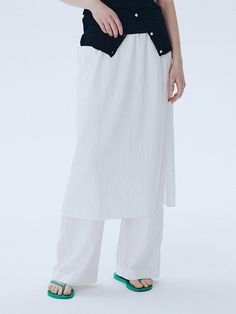 This is a modern and unique pants with skirt by ahwe that is made out of high quality and sturdy fabric. With minimal design detail and trendy mood, you can style it for your casual and refined daily outfit.- Elastic waistband- Skirt layered on top of the pants- Relaxed wide silhouette Chic Cotton Flowy Skirt, Versatile Daywear Relaxed Skirt, Modern Bottoms For Day Out In Summer, Versatile White Cotton Wide Leg Pants, Versatile White High Waist Wide Leg Pants, White High Waist Wide Leg Pants, Chic Relaxed Skirt For Daywear, Modern Cotton Bottoms For Daywear, White Elastic Waistband Bottoms For Work