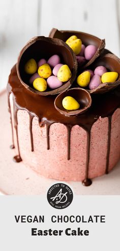 a cake with chocolate icing and candy eggs on top