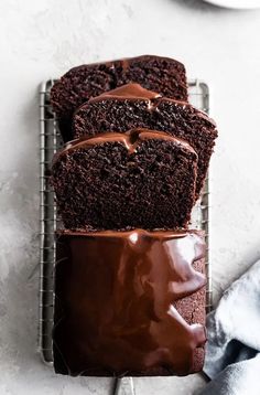 three slices of chocolate cake on a cooling rack