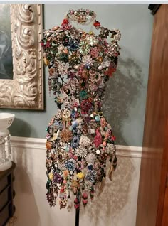 a dress made out of many different buttons