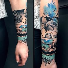 a woman's arm with blue flowers and leaves on her left arm, while another is