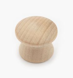 a wooden knob on a white background