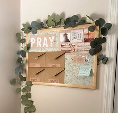 a bulletin board with leaves and paper on it