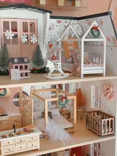 a doll house with all the furniture and accessories in it's display case,