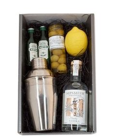 an assortment of liquors and lemons in a box