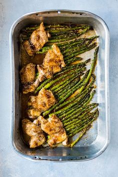 chicken and asparagus in a baking dish