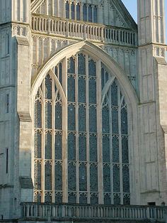 an old cathedral with large windows and arches