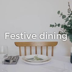 a table with plates and silverware on it that says festive dining