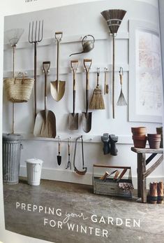 an open magazine with gardening tools hanging on the wall