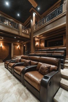 a home theater with brown leather seats