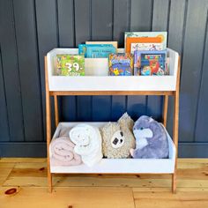 a shelf with books and stuffed animals on it