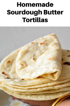 homemade sourdough butter tortillas on a plate with the title overlay