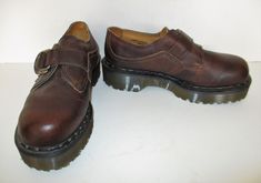 "Badass platform oxfords from Doc Martens. Vintage 1990s. Brown leather uppers. Monk strap with decorative logo buckle and velcro closure over the top. Chunky platform soles. Made in England. CONDITION: a few very minor signs of wear--overall in excellent vintage condition APPROXIMATE MEASUREMENTS: insole: 11 1/2\" width: 3 3/4\" heel height: 1 7/8\" At Mezcal + Leather, we spend many hours a week poring over racks and racks of less than stellar pieces looking for just the right items for you. W Organized Clothes, Vintage Doc Martens, Platform Oxfords, Oxford Platform Shoes, Oxford Platform, Oxfords Shoes, Chunky Shoes, Doc Marten Oxford, Buckle Shoes