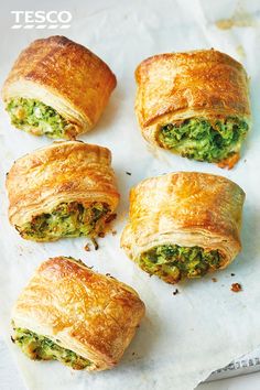 several pastries are arranged on a piece of parchment paper with the words tesco written below them