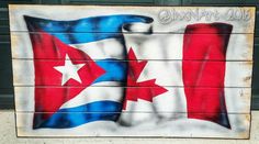 a wooden sign painted with the flag of texas and the state of texas on it