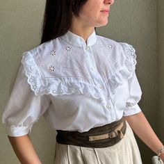 Cute vintage white cotton  blouse  with balloon sleeves and embroidery .  It is amazing!! **Material: 50%cotton,50%polyester.  **Great vintage condition, it's perfect white.  No holes or spots! ** Size40(M).  Model is size M and 170 cm height, bust 95 cm. Wear this adorable blouse under pinafore dresses or skirts for a cute daytime look. This item will come to you freshly laundered and ready to wear. White Bohemian Blouse With Collar, Vintage Broderie Anglaise Blouse For Summer, Short Sleeve Cotton Blouse With Lace Work, Bohemian Blouse With Broderie Anglaise Short Sleeves, White Broderie Anglaise Blouse For Daywear, Classic White Blouse With Broderie Anglaise, Classic White Broderie Anglaise Blouse, Vintage Cotton Blouse With Lace Work, Classic White Blouse For Vintage Fashion