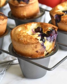 blueberry muffins are sitting on trays ready to be eaten