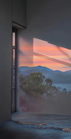 an open window overlooking the ocean and mountains