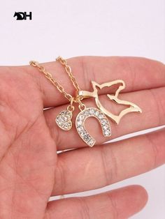 Horse necklace NZ Alloy Pendant Necklace With Charms, Gold Alloy Necklaces With Charms, Elegant Plated Charm Necklaces, Elegant Long Necklace With Charms, Elegant Metal Charm Necklaces, Elegant Metal Charm Necklace, Elegant Long Chain Necklace With Charms, Elegant Charm Necklaces With Delicate Chain, Elegant Alloy Jewelry With Charms