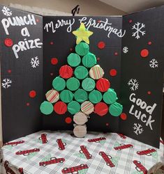 a christmas tree made out of cookies on top of a table with black and white paper