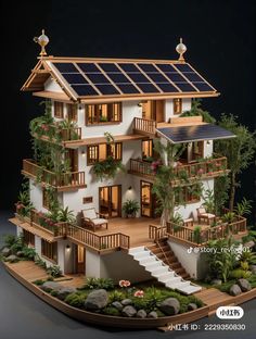 a model of a house with solar panels on the roof and balconies above it