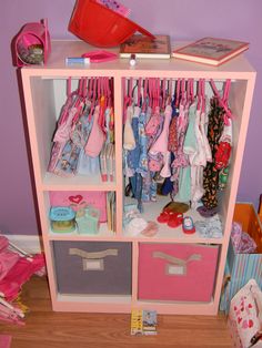 a toy closet with clothes and toys in it