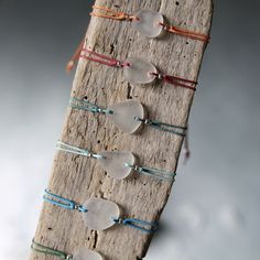 a piece of wood that has some glass beads on it and string around the strings