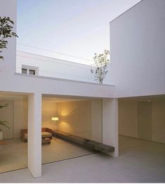 the interior of a modern house with white walls