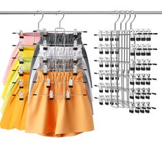 an assortment of skirts hanging on a rack with clips to hang them from the ceiling