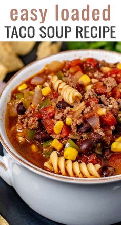 a white bowl filled with taco soup next to tortilla chips