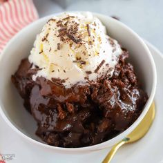 a white bowl filled with brownie and ice cream