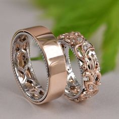 two gold wedding rings with diamond accents on each one and the other in rose gold