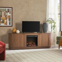 a living room with a television and fireplace