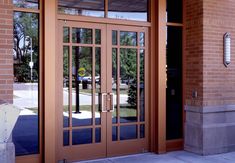 an entrance to a building with glass doors