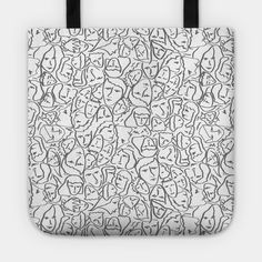 a white tote bag with black handles and an image of many faces on it