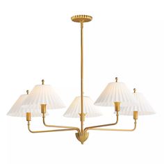 a brass chandelier with five shades of white lamps hanging from the bottom to the ceiling