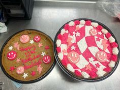 two cakes decorated with pink and white icing