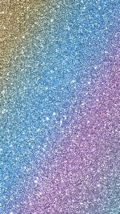 an abstract rainbow background with lots of small glitters on the edges and bottom half