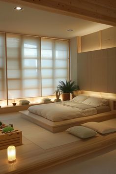 a large bed sitting in the middle of a room next to two windows with blinds