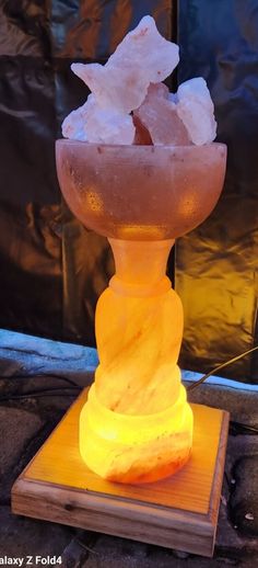 an ice cream sundae on a wooden stand