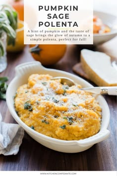 pumpkin sage polenta in a white bowl on a wooden table with bread and oranges behind it